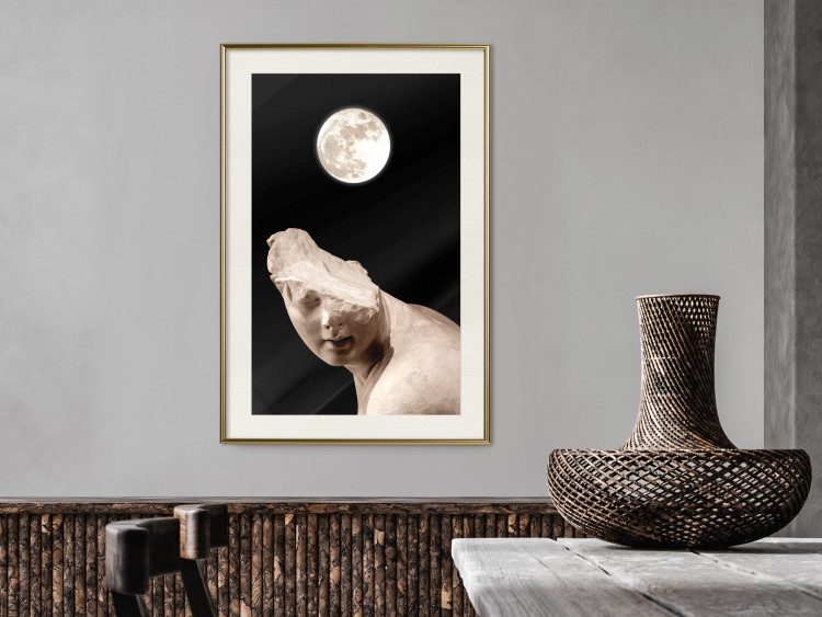 Poster Moon and Statue - whimsical sculpture without half of the head on a black background 129725 additionalImage 22