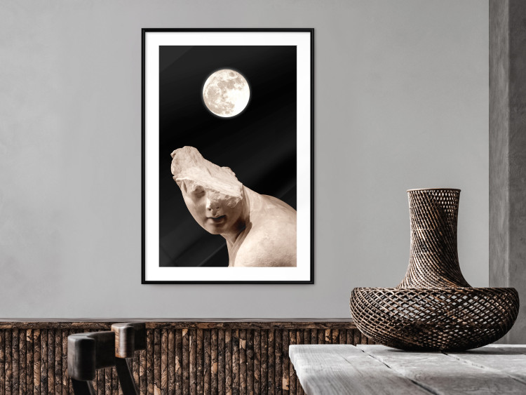 Poster Moon and Statue - whimsical sculpture without half of the head on a black background 129725 additionalImage 23