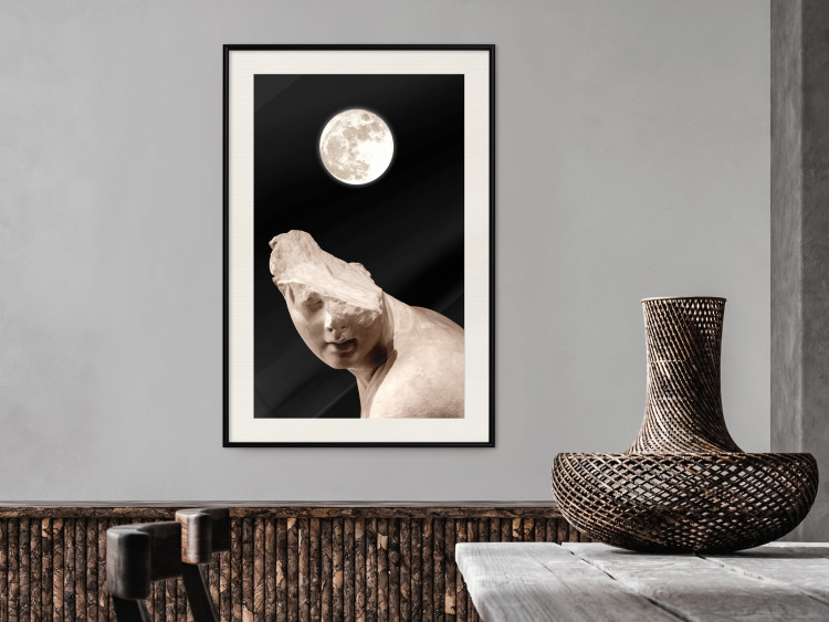 Poster Moon and Statue - whimsical sculpture without half of the head on a black background 129725 additionalImage 24
