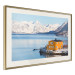 Wall Poster Silence and Peace - winter landscape of a yellow cottage by a lake and mountains 138725 additionalThumb 2