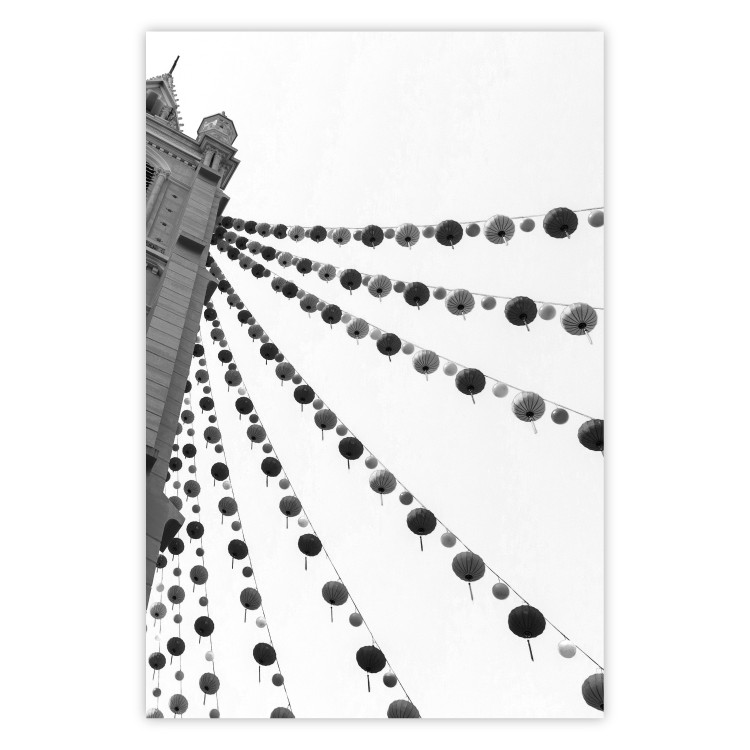 Poster Joyful Fair - gray architecture of a building with hanging decorations 129785