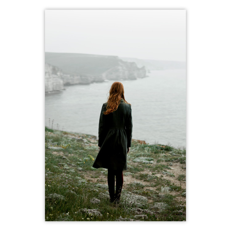 Poster What Now? - landscape of a woman dressed in green against the sea and rocks 130295