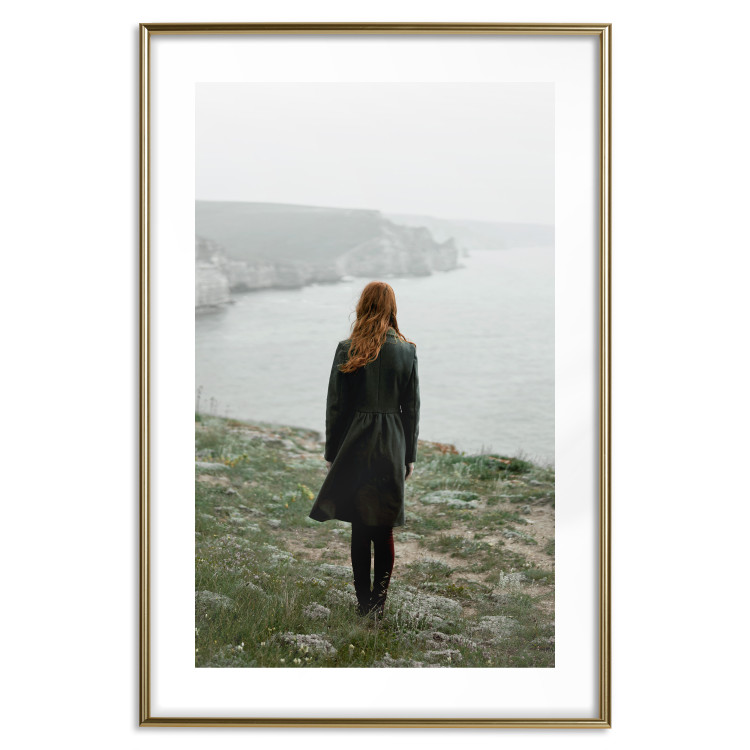 Poster What Now? - landscape of a woman dressed in green against the sea and rocks 130295 additionalImage 17