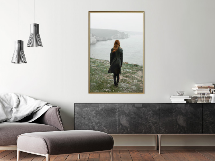 Poster What Now? - landscape of a woman dressed in green against the sea and rocks 130295 additionalImage 5