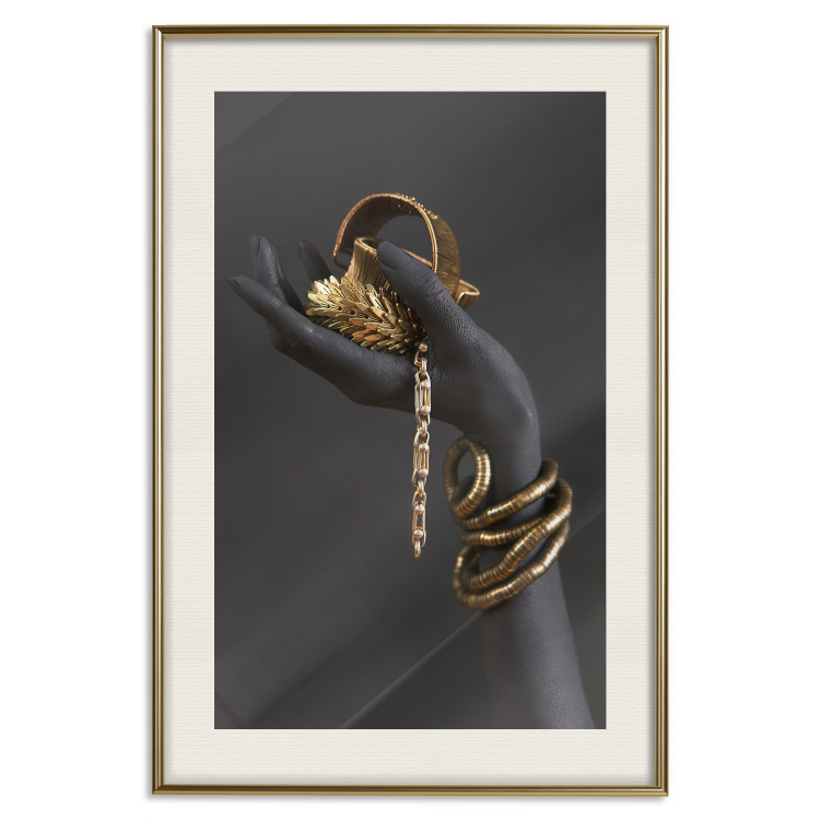 Wall Poster Royal Gifts - black hand with golden accessories on a dark background 130516 additionalImage 20