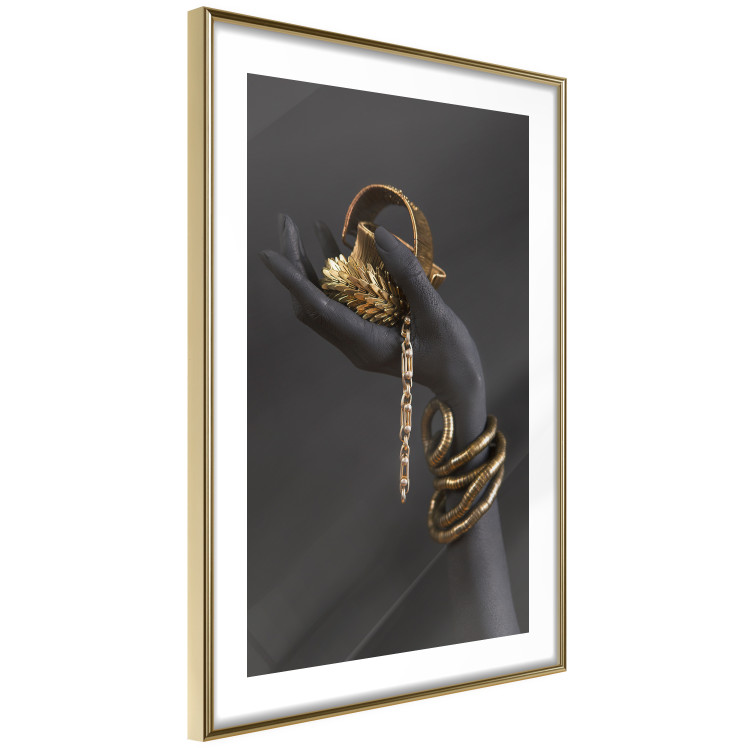 Wall Poster Royal Gifts - black hand with golden accessories on a dark background 130516 additionalImage 9