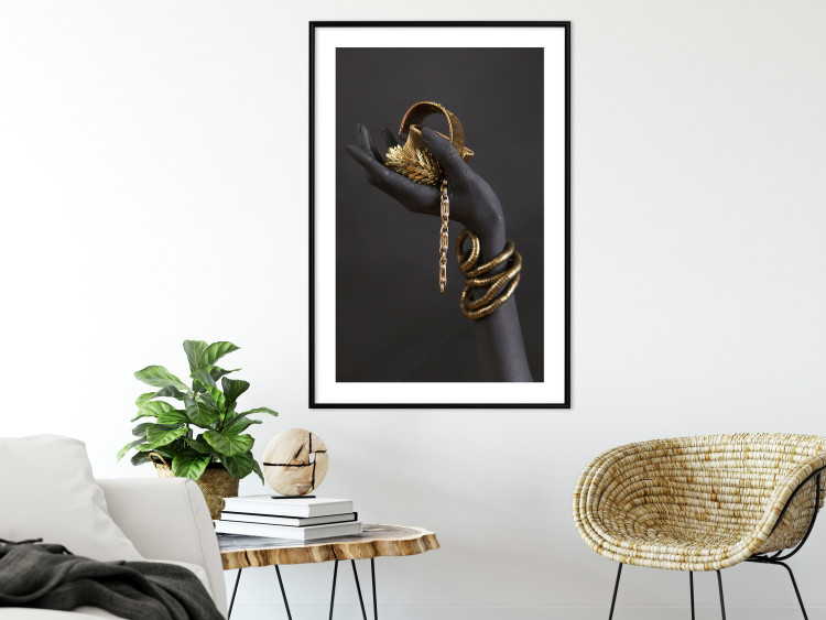 Wall Poster Royal Gifts - black hand with golden accessories on a dark background 130516 additionalImage 18