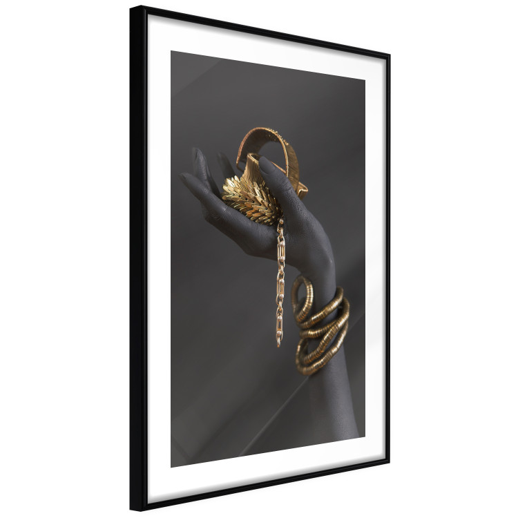 Wall Poster Royal Gifts - black hand with golden accessories on a dark background 130516 additionalImage 6