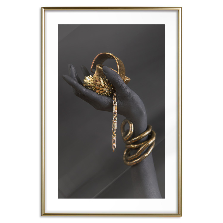 Wall Poster Royal Gifts - black hand with golden accessories on a dark background 130516 additionalImage 16