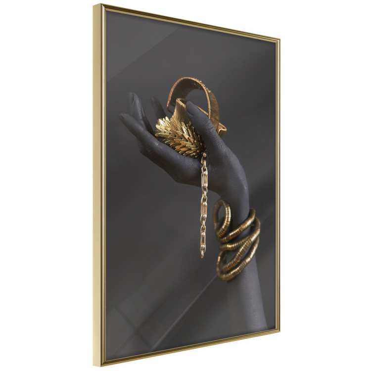Wall Poster Royal Gifts - black hand with golden accessories on a dark background 130516 additionalImage 12