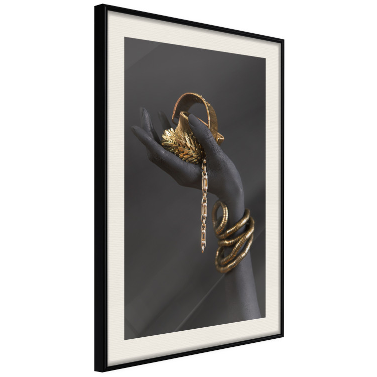 Wall Poster Royal Gifts - black hand with golden accessories on a dark background 130516 additionalImage 2