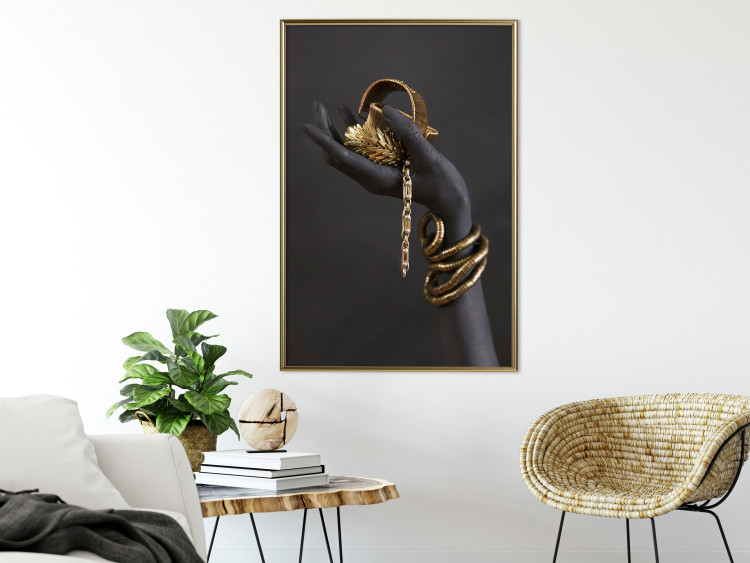 Wall Poster Royal Gifts - black hand with golden accessories on a dark background 130516 additionalImage 7