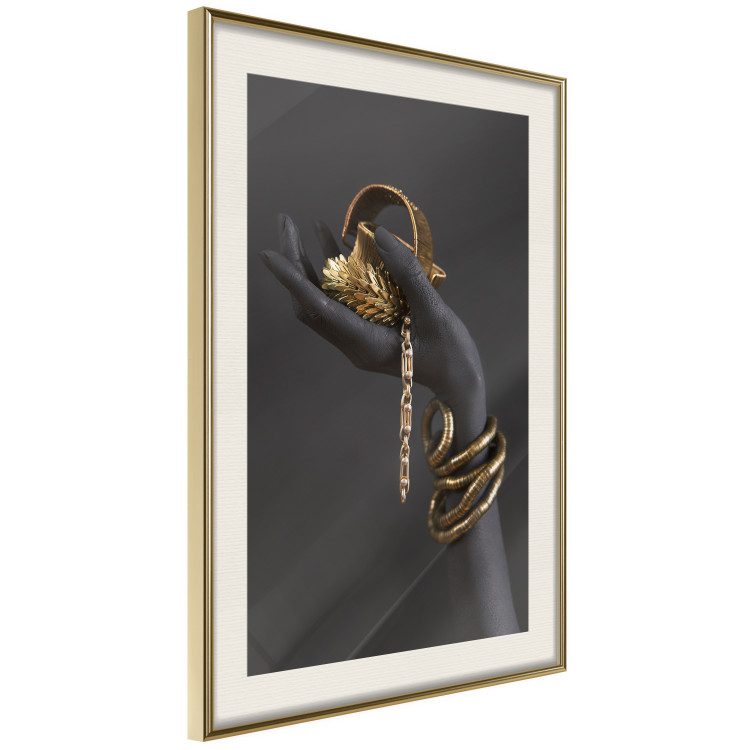 Wall Poster Royal Gifts - black hand with golden accessories on a dark background 130516 additionalImage 3