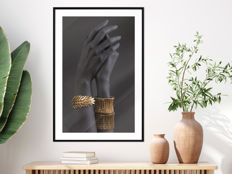 Poster Exotic Duet - black hands with golden accents on a dark background 130456 additionalImage 23