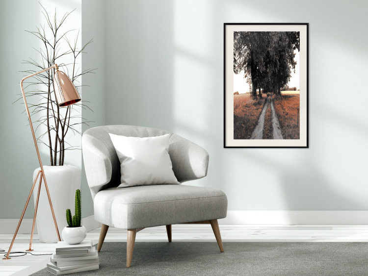 Wall Poster Road to the Forest - landscape of road and trees against orange meadow 124386 additionalImage 22