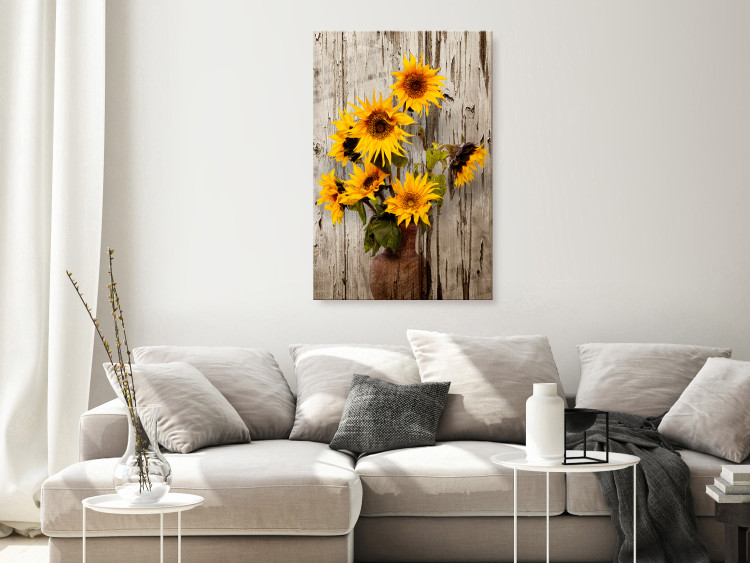 Canvas Art Print Sunflowers (1-piece) - yellow flowers in a vase on a wooden background 144596 additionalImage 3