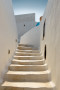 Wall Mural Santorini and Greece - city section with white stairs and 3D effect 105757