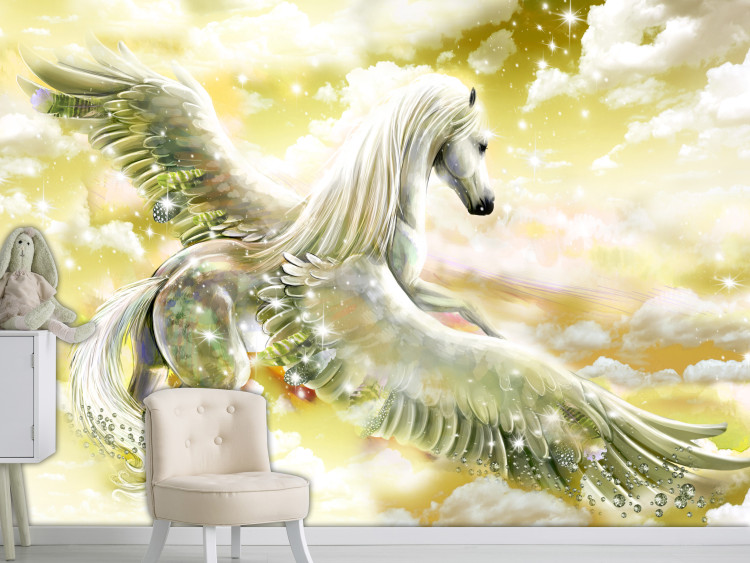 Wall Mural Pegasus - magical motif of a flying horse in clouds in yellow designs 107257