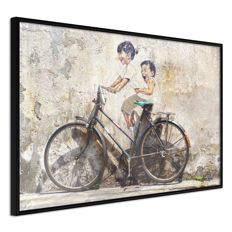 Wall Poster Carefree - retro black bicycle against a wall painted with children 130457 additionalImage 13
