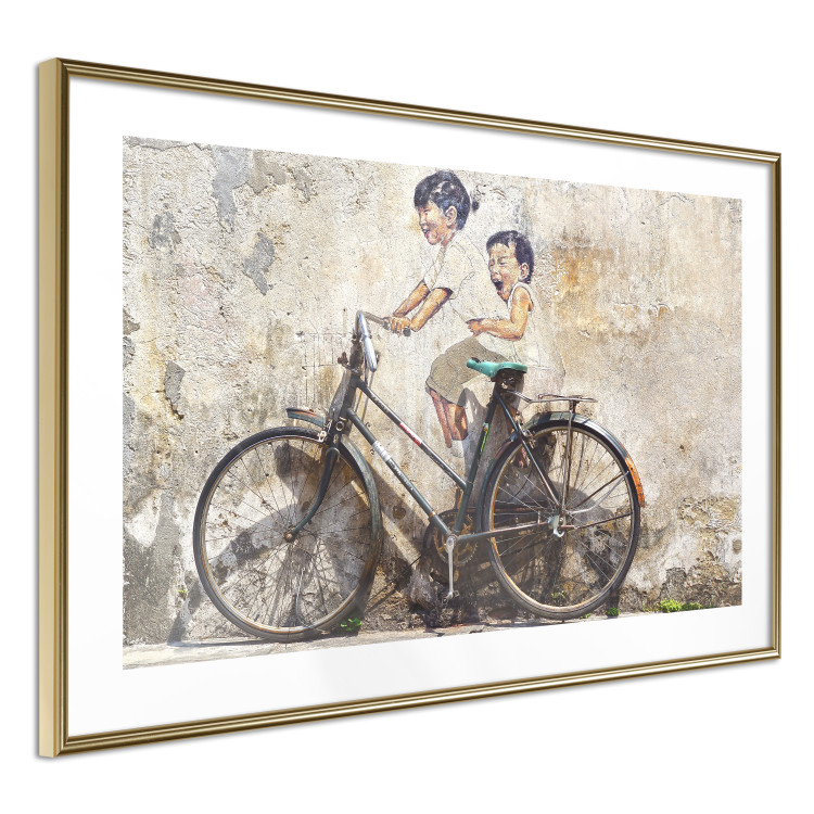 Wall Poster Carefree - retro black bicycle against a wall painted with children 130457 additionalImage 11