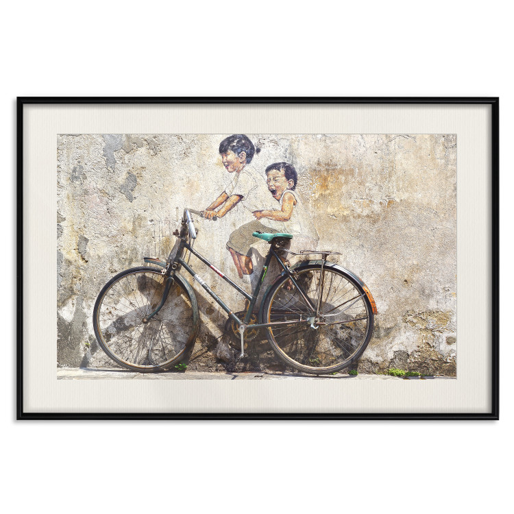 Wall Poster Carefree - retro black bicycle against a wall painted with children 130457 additionalImage 19