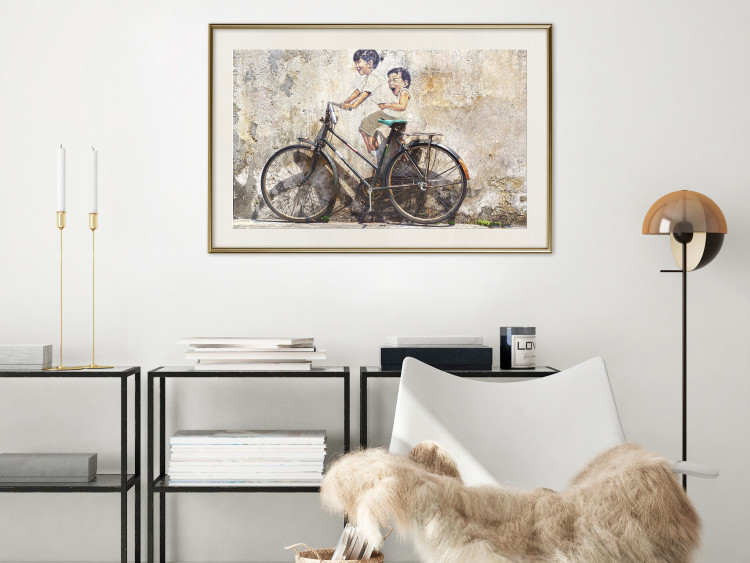 Wall Poster Carefree - retro black bicycle against a wall painted with children 130457 additionalImage 22