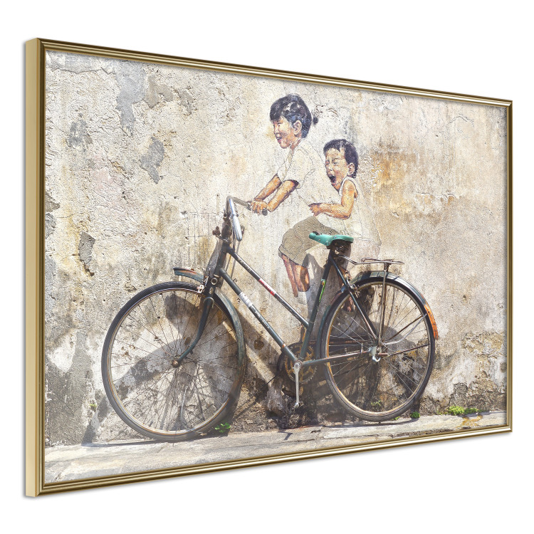 Wall Poster Carefree - retro black bicycle against a wall painted with children 130457 additionalImage 12