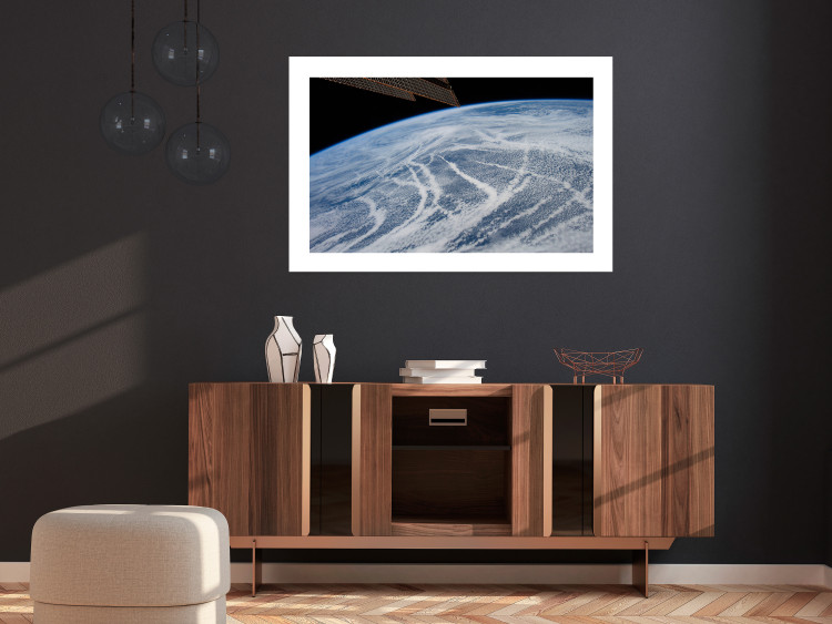 Wall Poster Restless Clouds - planet Earth landscape against backdrop of clouds and space 123177 additionalImage 2