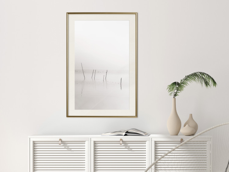 Wall Poster Misty Trail - landscape of sticks protruding from the water on a white background 130378 additionalImage 24
