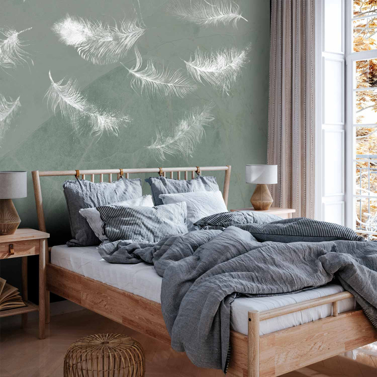 Wall Mural In flight - white feathers carried by the wind on an olive background with pattern 142639 additionalImage 2