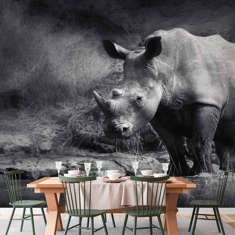 Wall Mural Peace of Animals - Black and white motif of a solitary rhinoceros on the savannah 61339 additionalImage 6