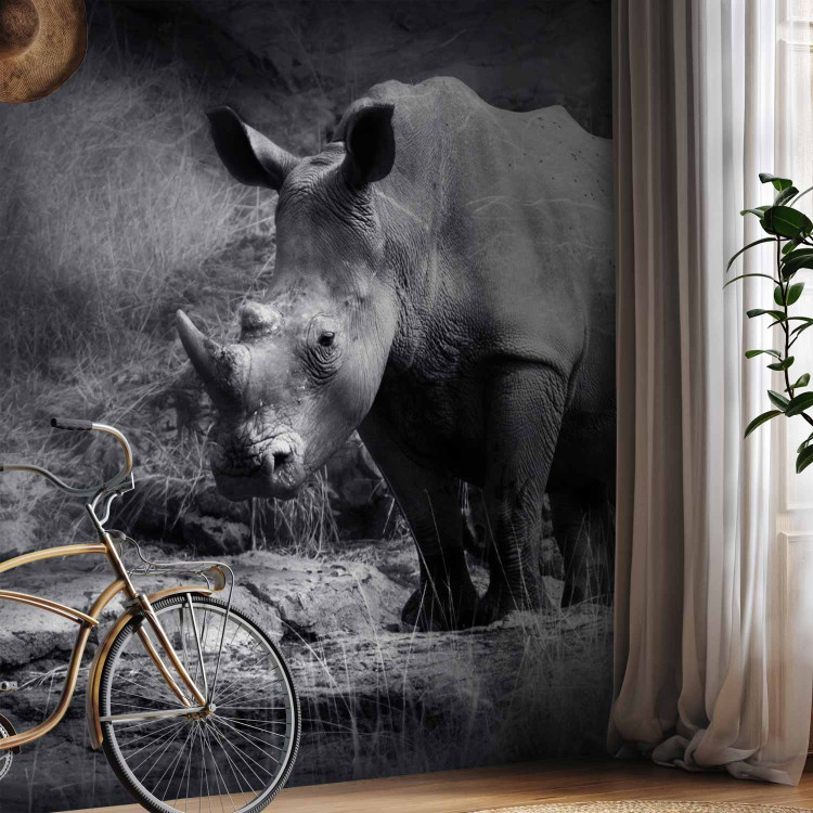 Wall Mural Peace of Animals - Black and white motif of a solitary rhinoceros on the savannah 61339 additionalImage 7