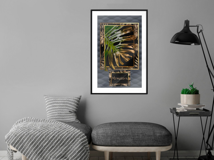 Poster Gilded Monstera - Composition with a tropical plant on a dark background 114359 additionalImage 4