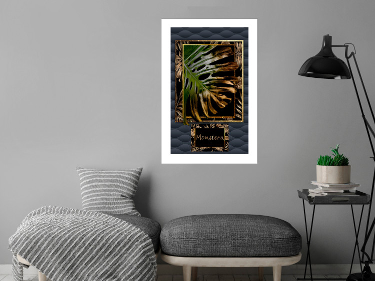 Poster Gilded Monstera - Composition with a tropical plant on a dark background 114359 additionalImage 2