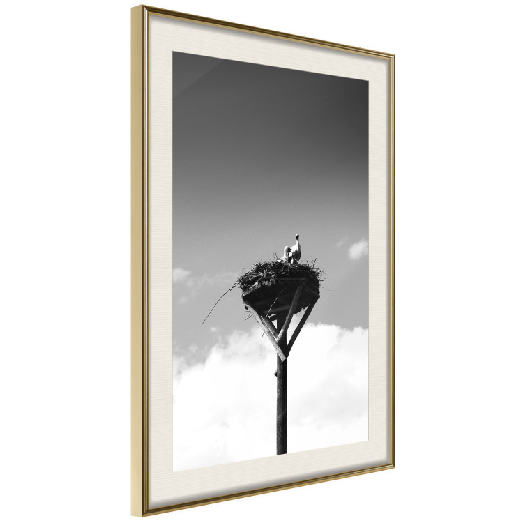 Wall Poster Stork's Nest - photograph of birds in a nest against a sky and clouds backdrop 122359 additionalImage 2