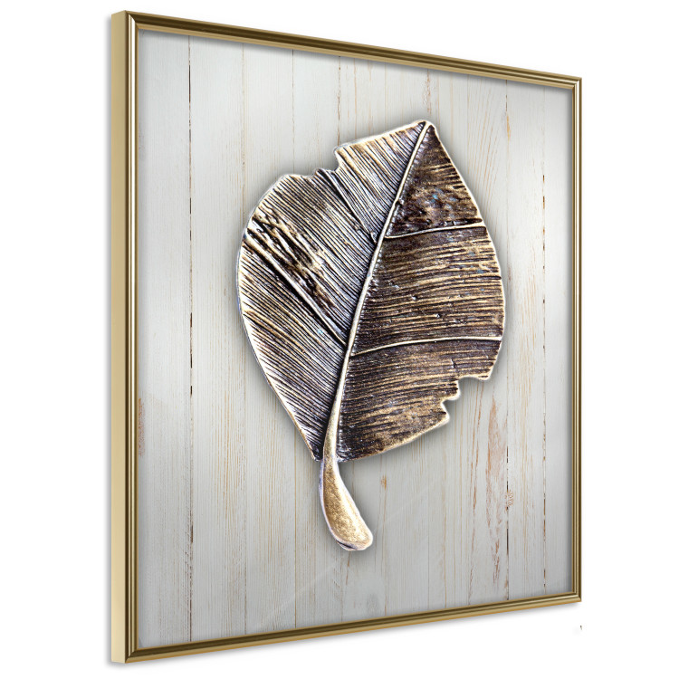 Poster Enchanted in Gold - autumn abstraction with a leaf on a light wood background 118789 additionalImage 12